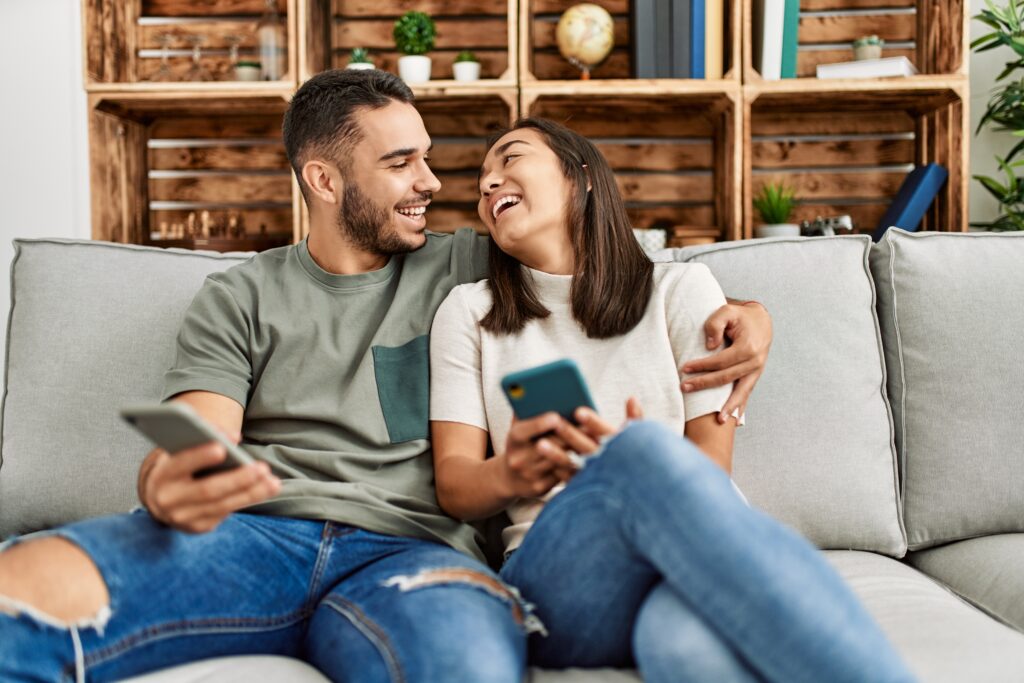 Couple deciding together what to share on social media